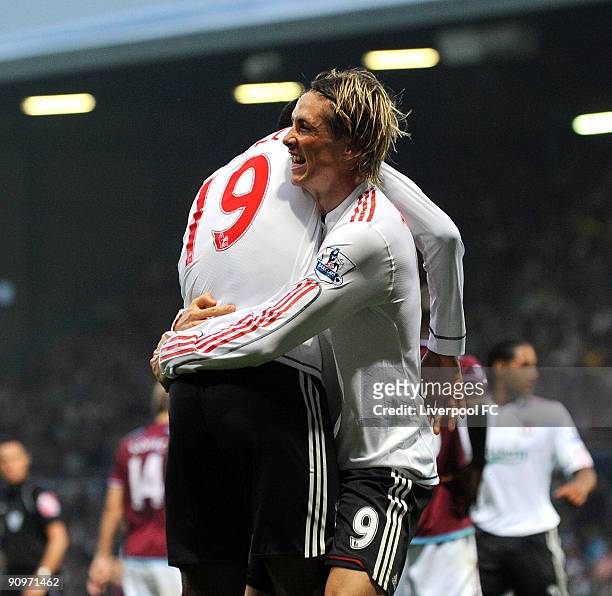 Fernando Torres of Liverpool celebrates with Ryan Babel after scoring the 3-2 goal for their team during the Barclays Premier League match between...