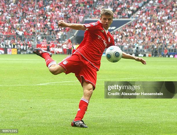 Thomas Mueller of Muenchen challenges for the ball during the Bundesliga match between FC Bayern Muenchen and 1. FC Nuernberg at Allianz Arena on...