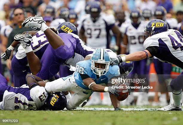 Erik Highsmith of the North Carolina Tar Heels stretches out for a first down against the East Carolina Pirates at Kenan Stadium on September 19,...