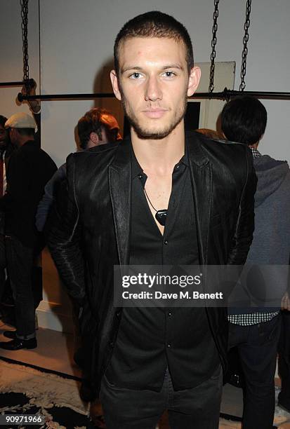 Alex Pettyfer attends the launch party of the Kinder Aggugini pop-up store, at Kinder Aggugini on September 19, 2009 in London, England.