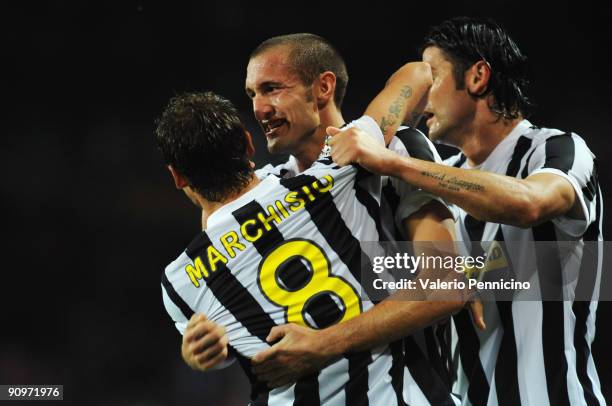 Claudio Marchisio of Juventus FC celebrate his goal with Giorgio Chiellini and Vincenzo Iaquinta during the Serie A match between Juventus FC and AS...