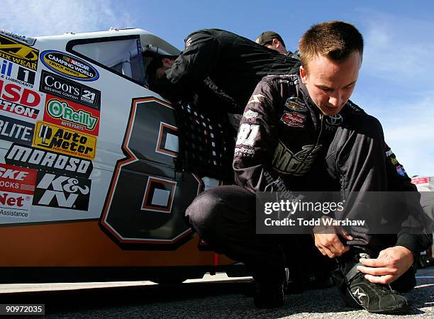 Tayler Malsam, driver of the One-Eighty Toyota, prepares to drive before the NASCAR Camping World Truck Series Heluva Good! 200 at the New Hampshire...