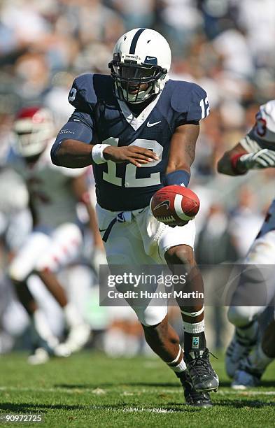 Quarterback Kevin Newsome of the Penn State Nittany Lions hands-off during a game against the Temple Owls on September 19, 2009 at Beaver Stadium in...
