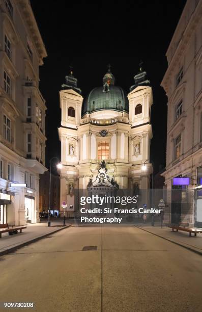 st. peter's church facade (peterskirche) illuminated at night in vienna, austria - graben stock pictures, royalty-free photos & images