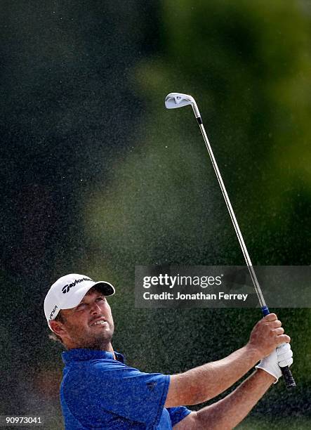 Blake Adams hits out of the bunker on the 5th hole during the third round of the Albertson's Boise Open at Hillcrest Country Club on September 18,...