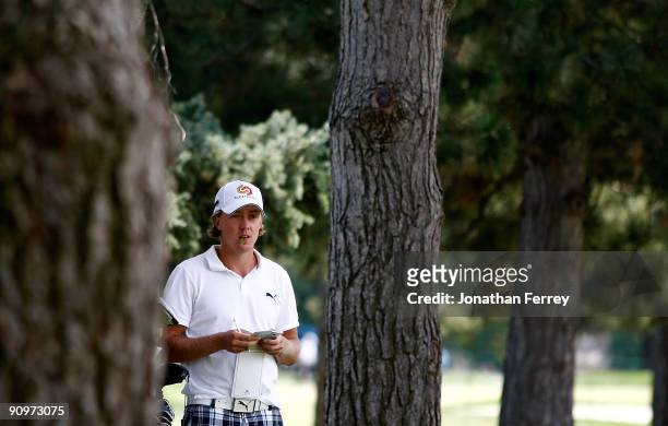 Jonas Blixt of Sweden waits to hit out of the trees on the 5th hole during the third round of the Albertson's Boise Open at Hillcrest Country Club on...