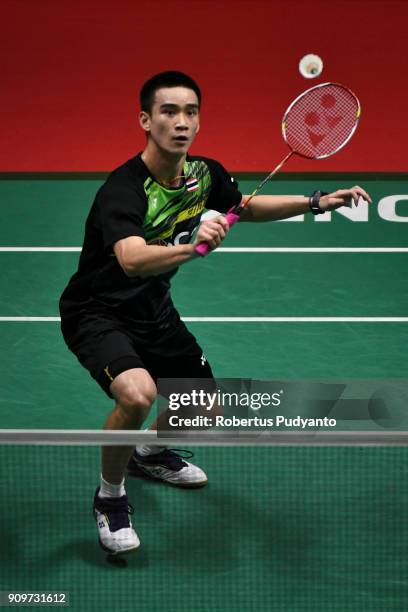 Kantaphon Wangcharoen of Thailand competes against Lin Dan of China during Men Singles Round 32 of the Daihatsu Indonesia Masters 2018 at Istora...