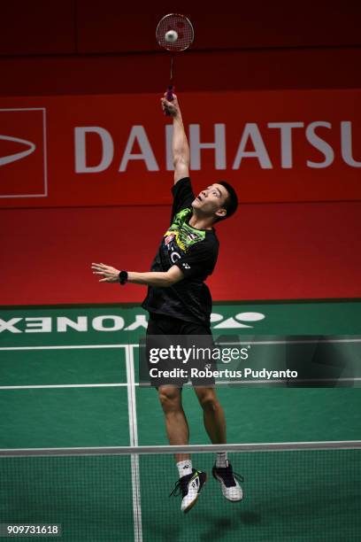 Kantaphon Wangcharoen of Thailand competes against Lin Dan of China during Men Singles Round 32 of the Daihatsu Indonesia Masters 2018 at Istora...