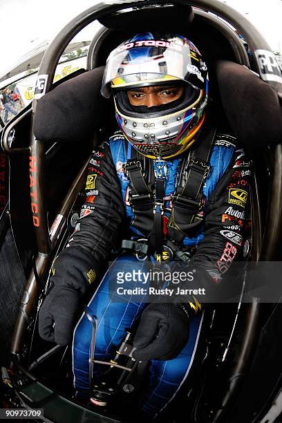 Antron Brown, driver of the Matco Tools top fuel dragster prepares to drive during qualifying for the NHRA Carolinas Nationals on September 19, 2009...