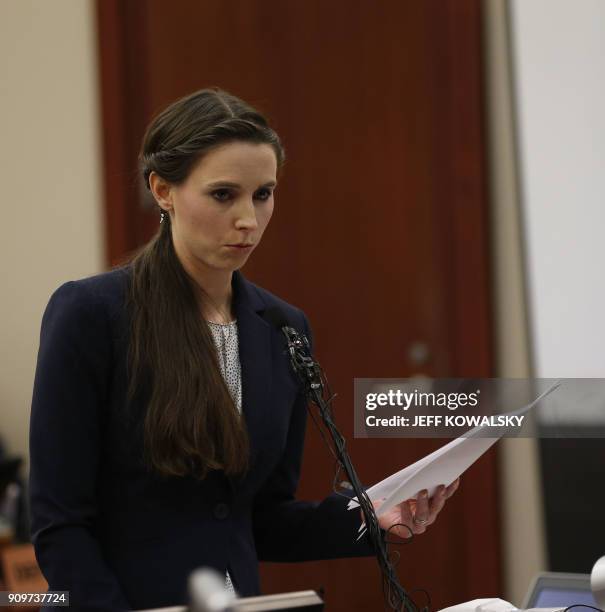Rachael Denhollander gives her statement as former Michigan State University and USA Gymnastics doctor Larry Nassar listens during impact statements...