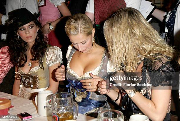 Kristina Liliana, Verena Kerth and guest attend the Oktoberfest 2009 opening at Kaefer Schaenke at the Theresienwiese on September 19, 2009 in...