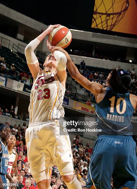 Katie Douglas of the Indiana Fever gets fouled b y Lindsey Harding of the Washington Mystics during Game Two of the Eastern Conference Semifinals at...