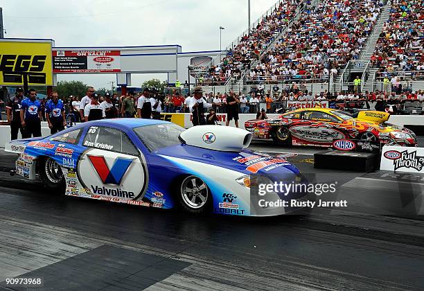 Ron Kirsher, driver of the Valvoline pro stock Chevrolet lines up to race Ryan Ondrejko, driver of the Wiley X GXP pro stock during qualifying for...