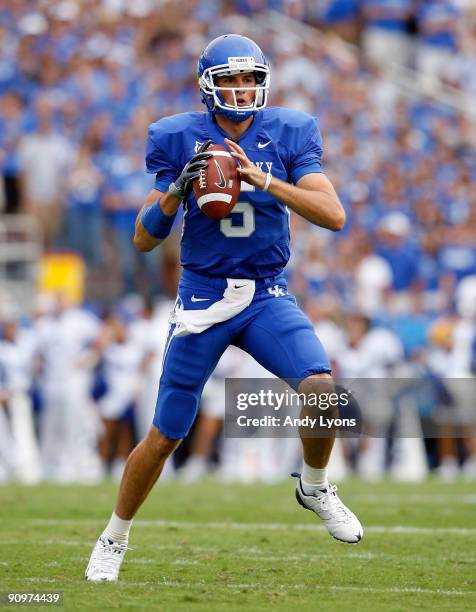 Mike Hartline of the Kentucky Wildcats throws a pass during the game against the Louisville Cardinals at Commonwealth Stadium on September 19, 2009...