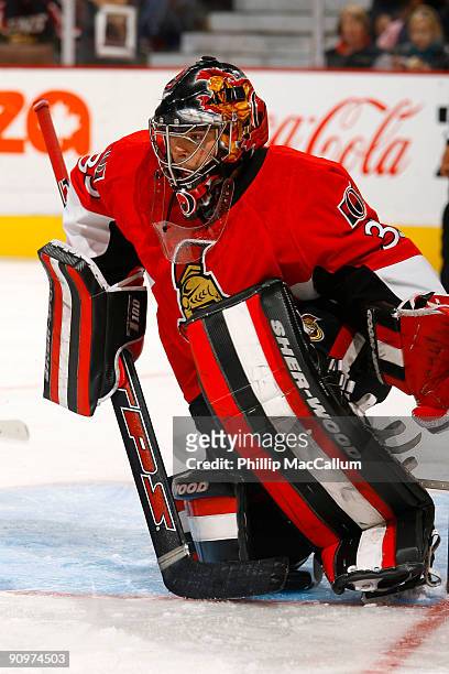 Pascal Leclaire of the Ottawa Senators goes down on one knee to make a save against the Montreal Canadiens during a preseason game at Scotiabank...