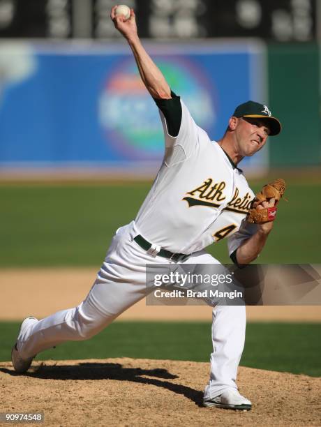 Michael Wuertz of the Oakland Athletics pitches against the Cleveland Indians during the game at the Oakland-Alameda County Coliseum on September 19,...