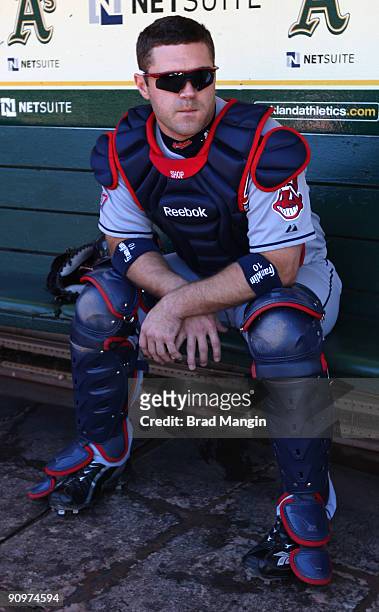 Kelly Shoppach of the Cleveland Indians gets ready in the dugout before the game against the Oakland Athletics at the Oakland-Alameda County Coliseum...