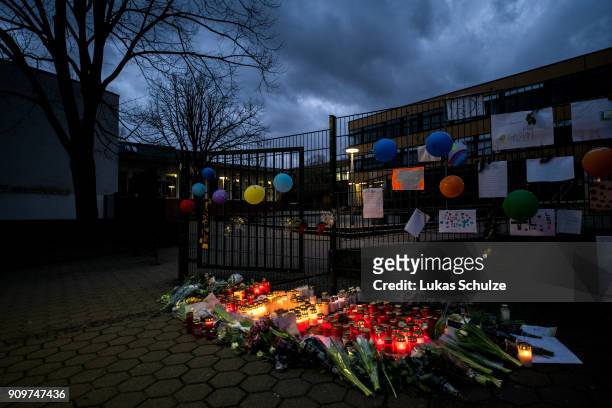 Flowers and candles are left at a makeshift memorial placed in front of the Kaethe Kollwitz comprehensive school following the stabbing of a pupil...