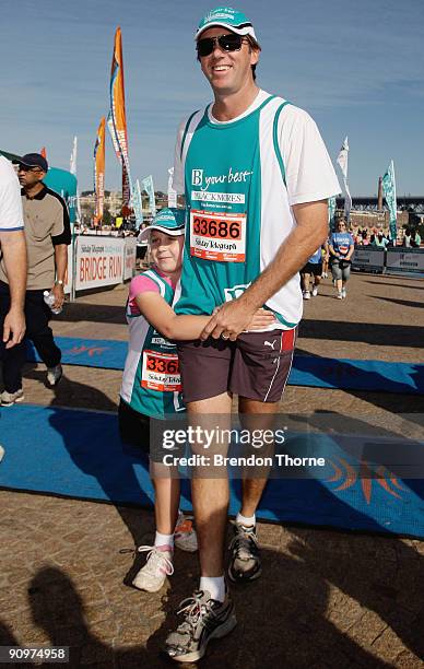 Glenn McGrath is seen with his Daughter Holly during The Sydney Running Festival at the Family Fun Run on September 20, 2009 in Sydney, Australia.