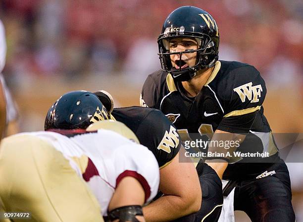 Quarterback Riley Skinner of the Wake Forest Demon Deacons calls out signals against the Elon Phoenix at BB&T Field on September 19, 2009 in Winston...