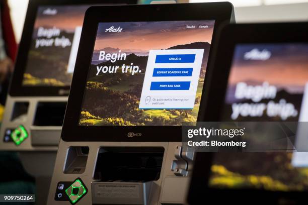 Alaska Air Group Inc. Self check-in kiosks stand at the San Francisco International Airport in San Francisco, California, U.S., on Friday, Jan. 19,...