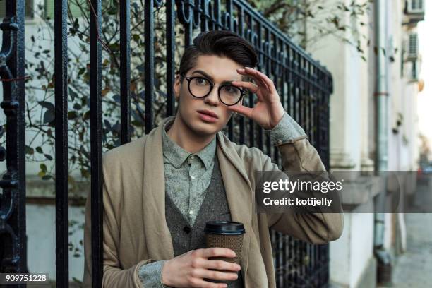 handsome man in a city street - handsome teen boy outdoors stock pictures, royalty-free photos & images
