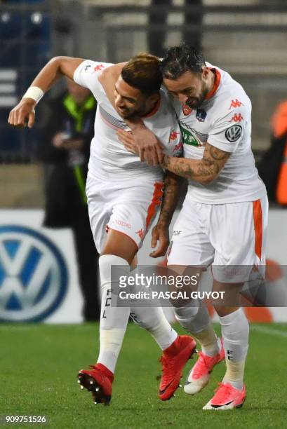Lorient players react after scoring a goal during the French Cup round of 16 football match Montpellier vs Lorient at the La Mosson stadium in...