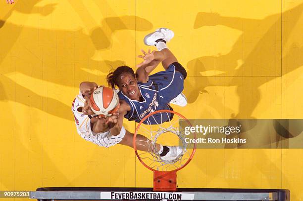 Chasity Melvin of the Washington Mystics battles Tammy Sutton-Brown of the Indiana Fever during Game 2 of the Eastern Conference Semifinals at...