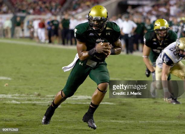 Quarterback B.J. Daniels of the South Florida Bulls runs the ball for a touchdown against the Charleston Southern Buccaneers during the game at...