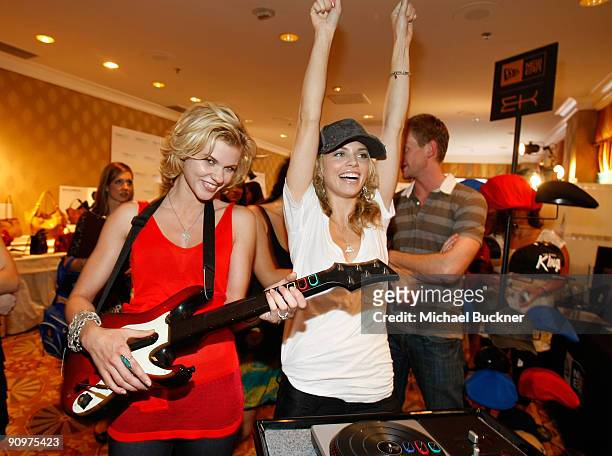 Angel McCord and sister actress AnnaLynne McCord pose at the Activision booth during the HBO Luxury Lounge in honor of the 61st Primetime Emmy Awards...