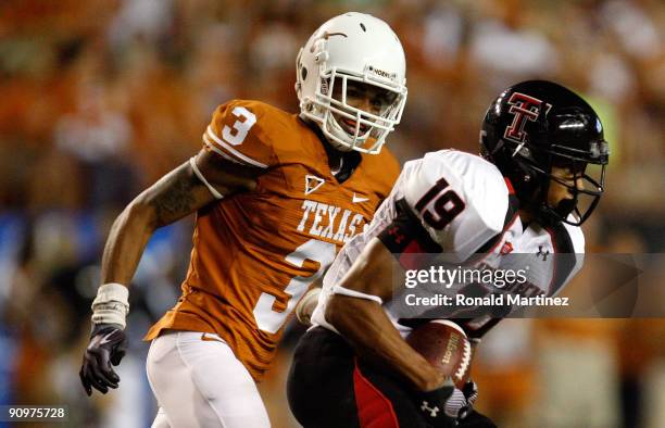 Wide receiver Lyle Leong of the Texas Tech Red Raiders runs the ball past Curtis Brown of the Texas Longhorns at Darrell K Royal-Texas Memorial...