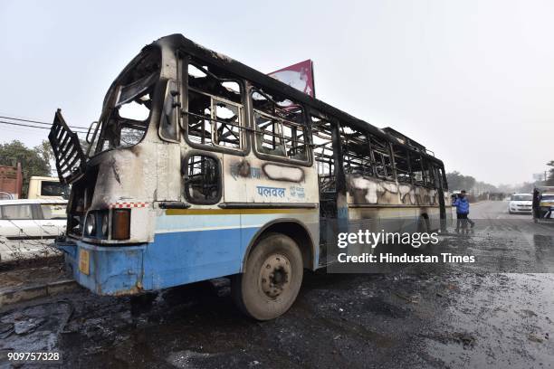 Haryana Roadways bus that was set on fire today near village Bhondsi allegedly by activists of Karni Sena, who were protesting against the release of...