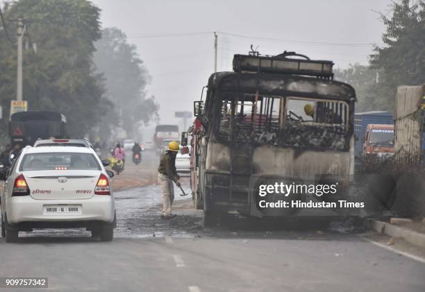 Haryana Roadways bus that was set on fire today near village Bhondsi allegedly by activists of Karni Sena, who were protesting against the release of...