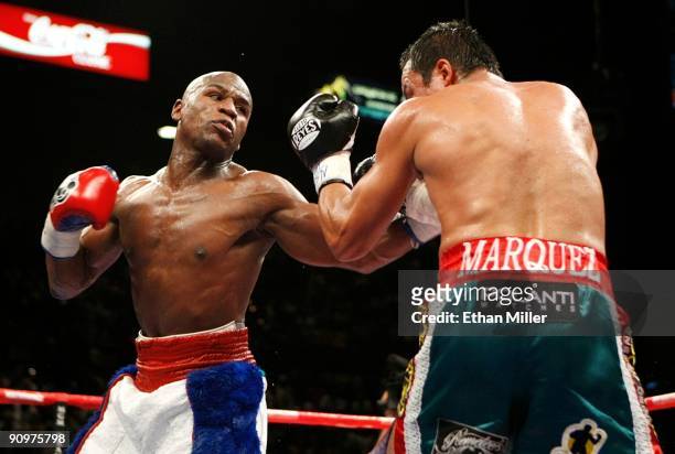 Floyd Mayweather Jr. Throws a left to the body of Juan Manuel Marquez of Mexico during their welterweight bout at the MGM Grand Garden Arena...