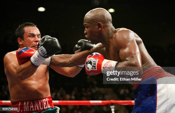 Floyd Mayweather Jr. Throws a right to the head of Juan Manuel Marquez of Mexico during their welterweight bout at the MGM Grand Garden Arena...