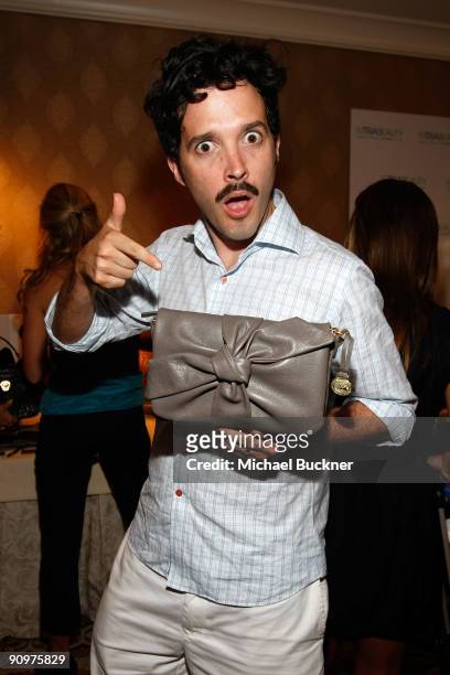 Actor Bret McKenzie poses at the Brahmin booth during the HBO Luxury Lounge in honor of the 61st Primetime Emmy Awards held at the Four Seasons Hotel...