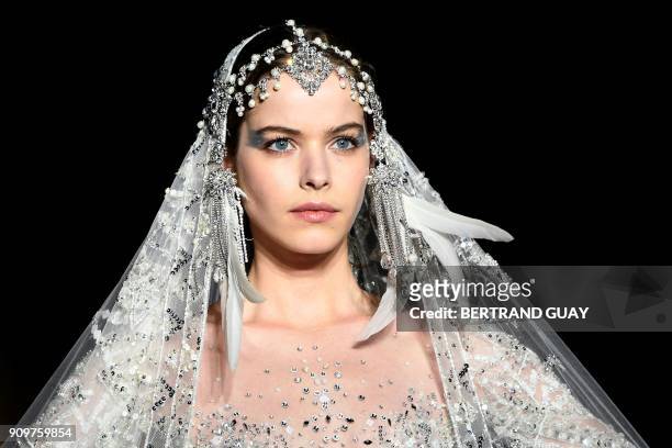 Model presents a creation by Zuhair Murad during the 2018 spring/summer Haute Couture collection fashion show on January 24, 2018 in Paris.