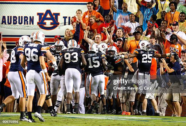 Craig Stevens of the Auburn Tigers celebrates his interception return for a touchdown in the final minutes of their 41-30 win over the West Virginia...