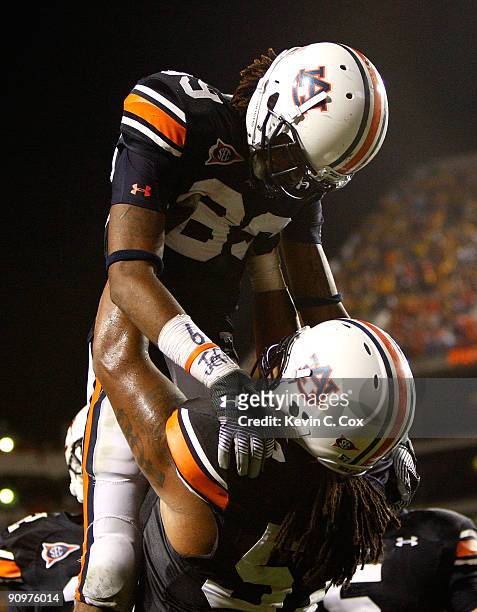 Darvin Adams of the Auburn Tigers celebrates his touchdown with Byron Isom against the West Virginia Mountaineers at Jordan-Hare Stadium on September...
