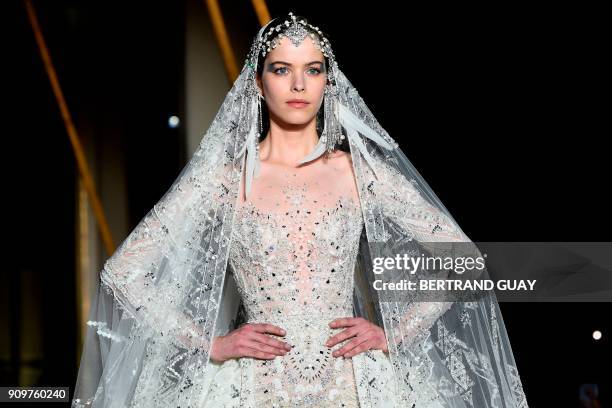 Model presents a creation by Zuhair Murad during the 2018 spring/summer Haute Couture collection fashion show on January 24, 2018 in Paris. / AFP...