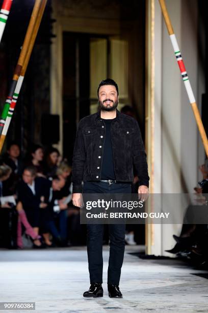 Lebanese fashion designer Zuhair Murad acknowledges the audience at the end of his fashion show during the 2018 spring/summer Haute Couture...