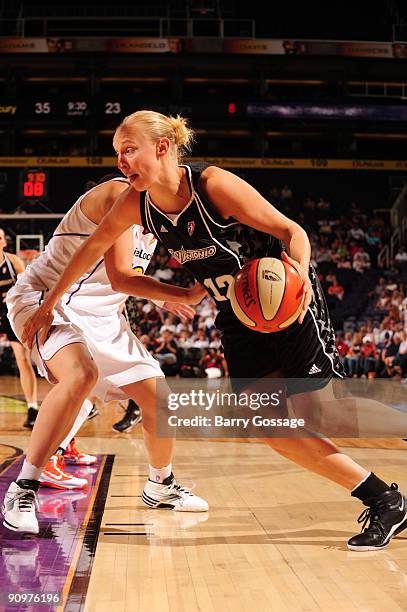 Ann Wauters of the San Antonio Silver Stars drives to the basket against Nicole Ohlde of the Phoenix Mercury in Game Two of the WNBA Western...