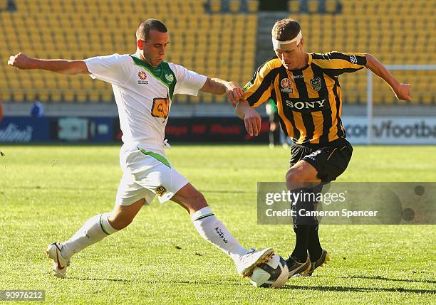 James Robinson of Fury FC contests the ball with Tony Lochhead of the Phoenix during the round seven A-League match between the Wellington Phoneix...