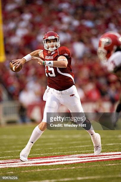 Ryan Mallett of the Arkansas Razorbacks rolls out to throw a pass against the Georgia Bulldogs at Donald W. Reynolds Stadium on September 19, 2009 in...