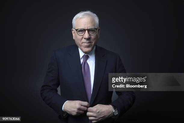David Rubenstein, co-chief executive officer of the Carlyle Group LP, poses for a photograph following a Bloomberg Television interview on day two of...