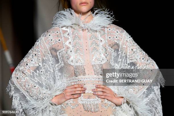 Model presents a creation by Zuhair Murad during the 2018 spring/summer Haute Couture collection fashion show on January 24, 2018 in Paris. / AFP...