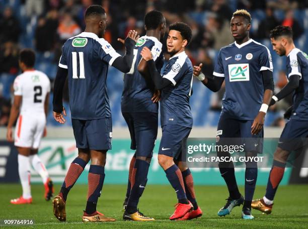 Montpellier's players celebrate after scoring a goal during the French Cup round of 16 football match between Montpellier and Lorient at the La...