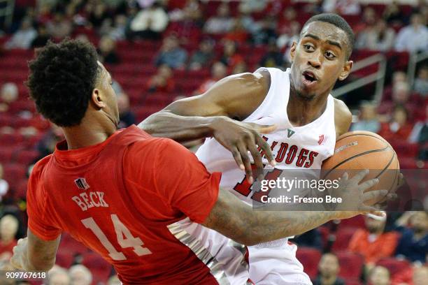 Fresno State's Bryson Williams, right, gets called for a charge on UNLV's Tervell Beck in the first half on Tuesday, Jan. 23, 2018 at the Save Mart...