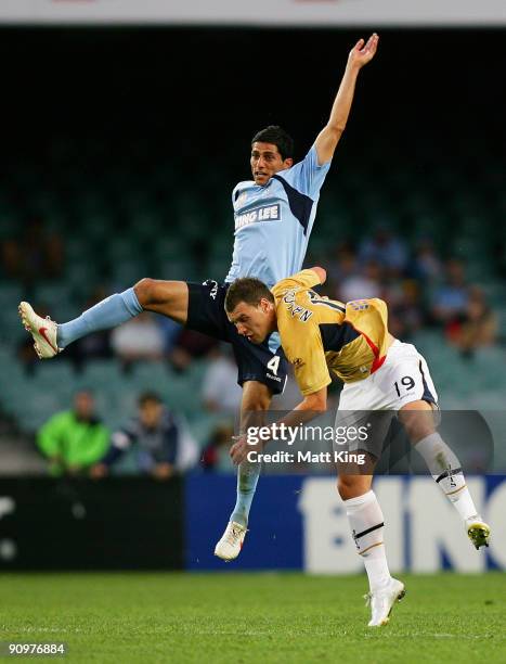 Simon Colosimo of Sydney and Jason Naidovski of the Jets compete for a header during the round seven A-League match between Sydney FC and the...