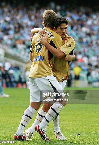 Matthew Thompson celebrates with Kaz Patafta of the Jets after scoring a goal during the round seven A-League match between Sydney FC and the...